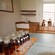 10 whisky jars set up next to 5 glasses for a tasting